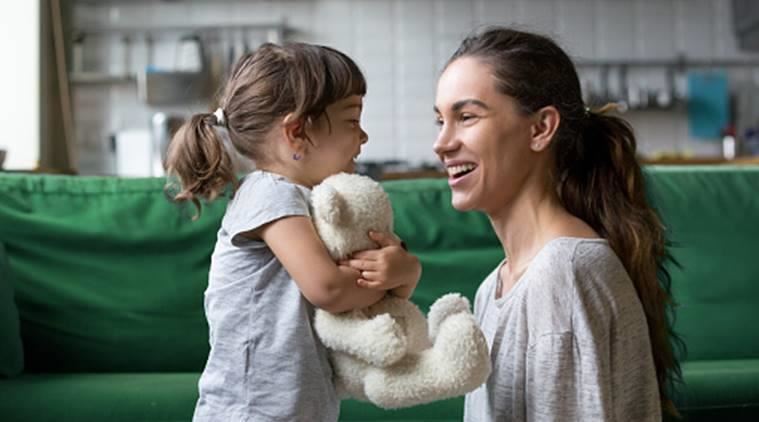 Mother and young child talking